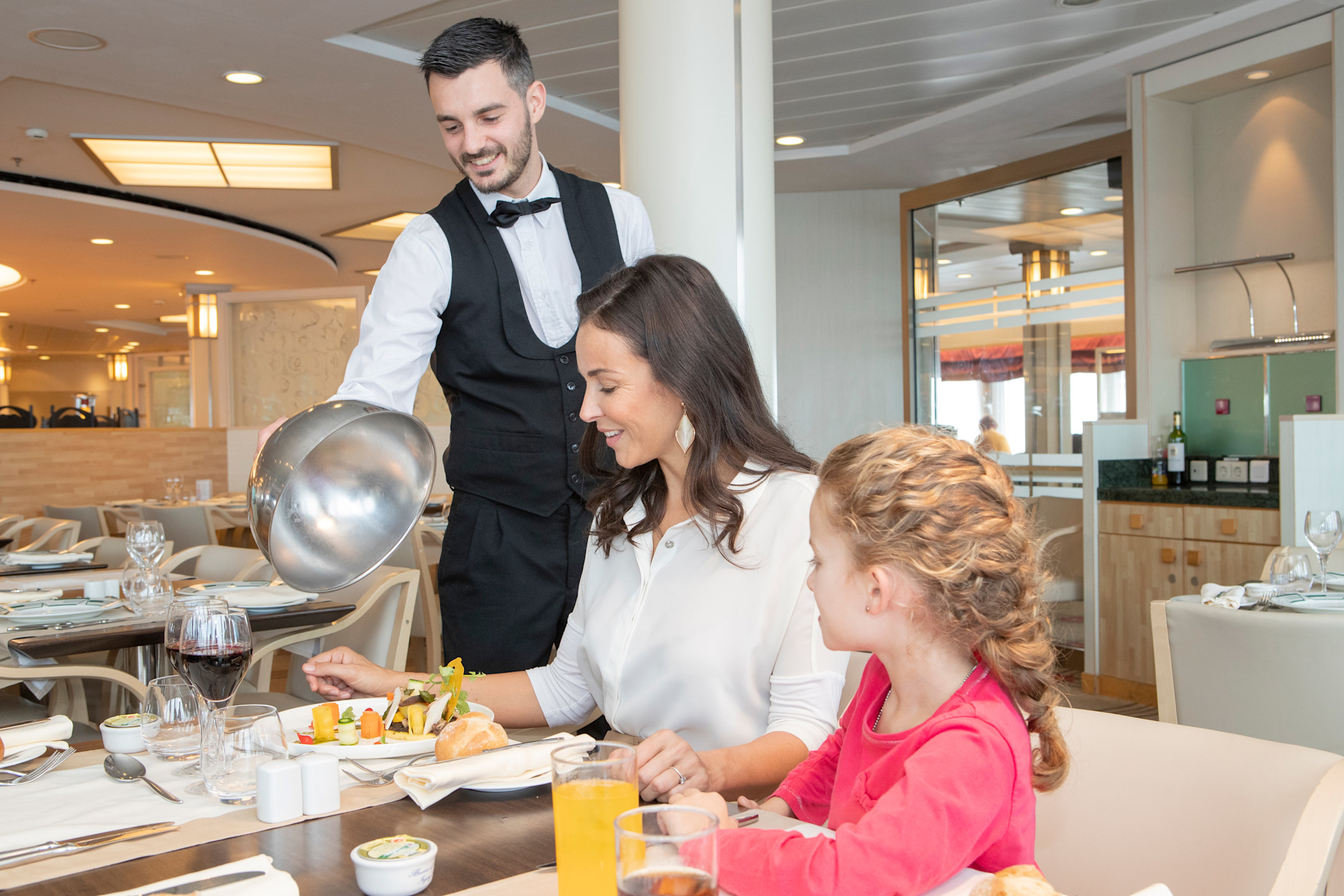Woman being served her meal in the main restaurant