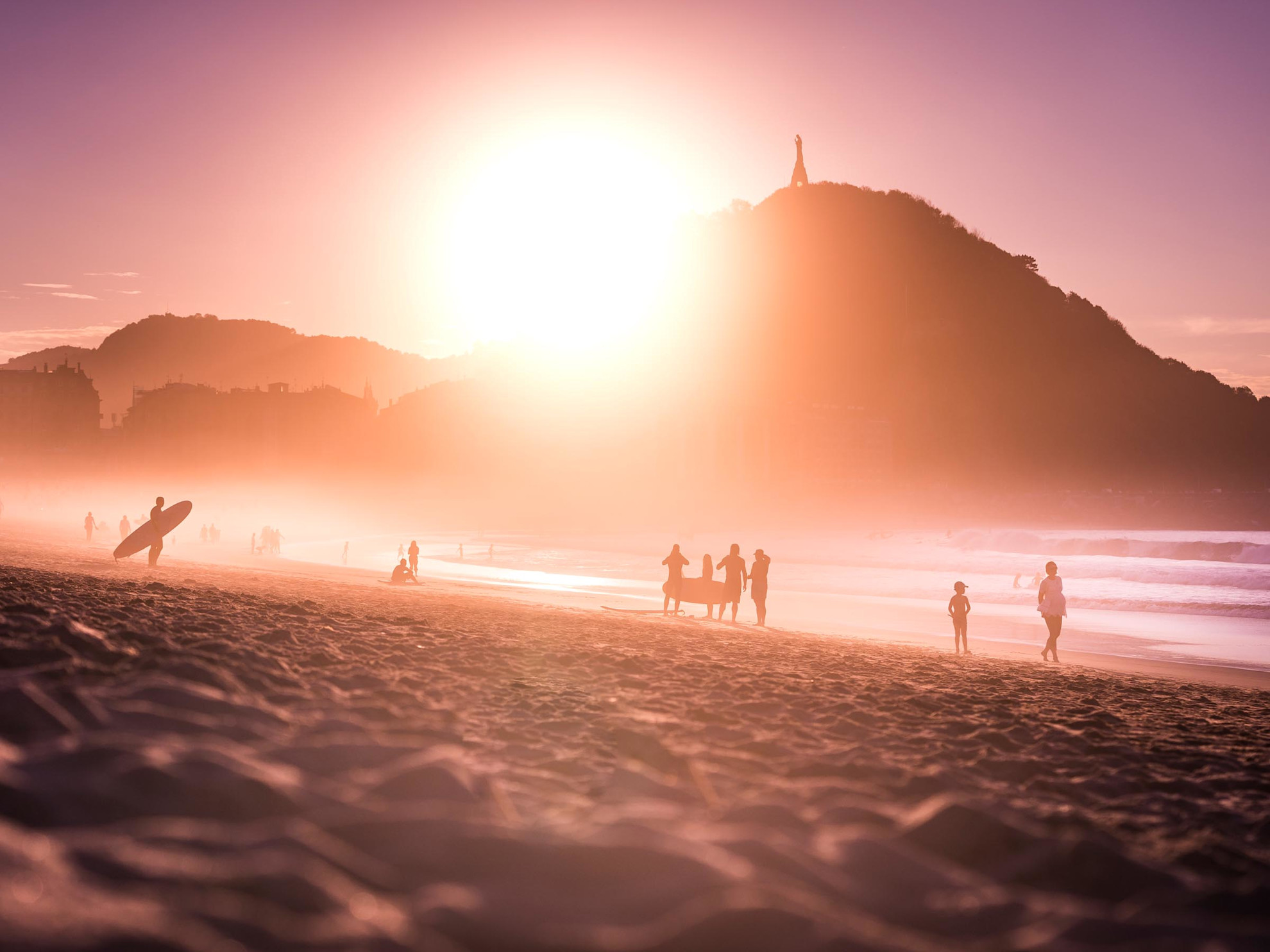 Surfers on Zurriola beach at sunset © @donostiaturismoa