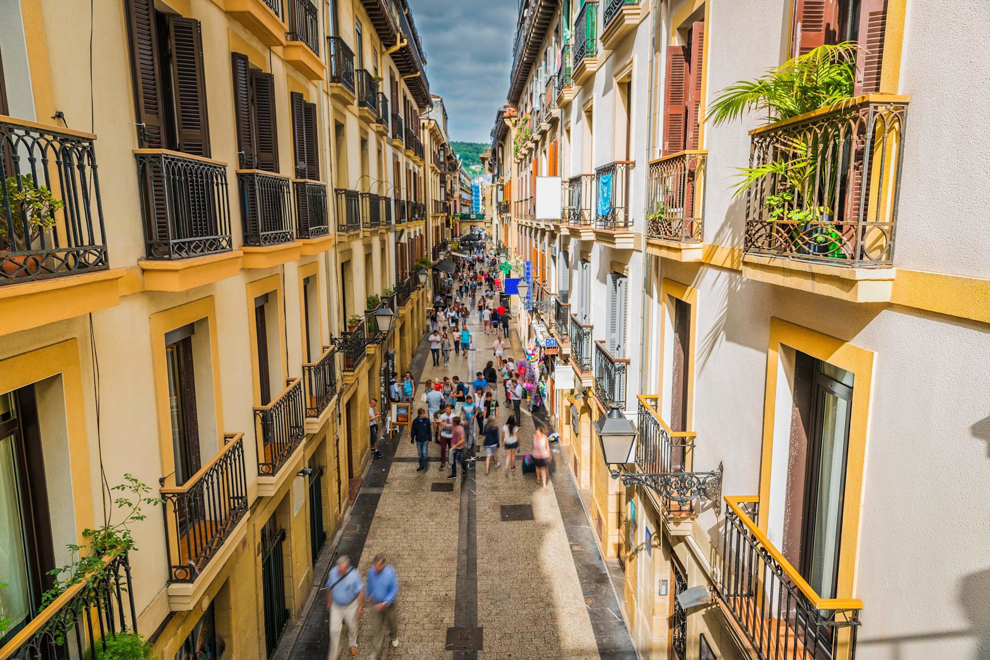 An elegant, narrow street in San Sebastián's bustling Old Town