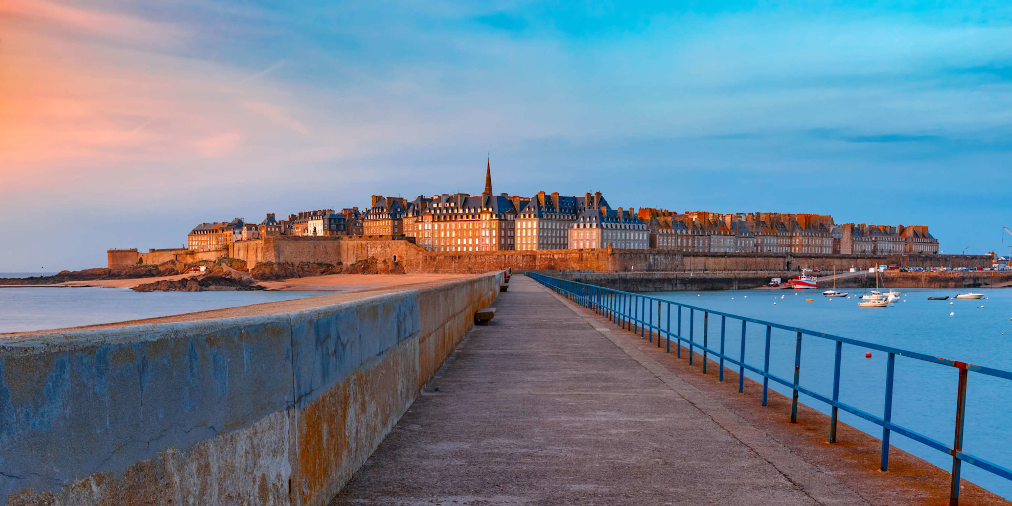 Panoramic view of walled city Saint-Malo with St Vincent Cathedral at sunset