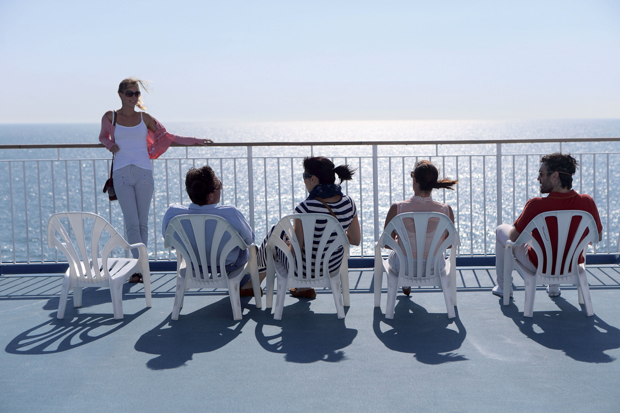 Passengers sunbathing on deck