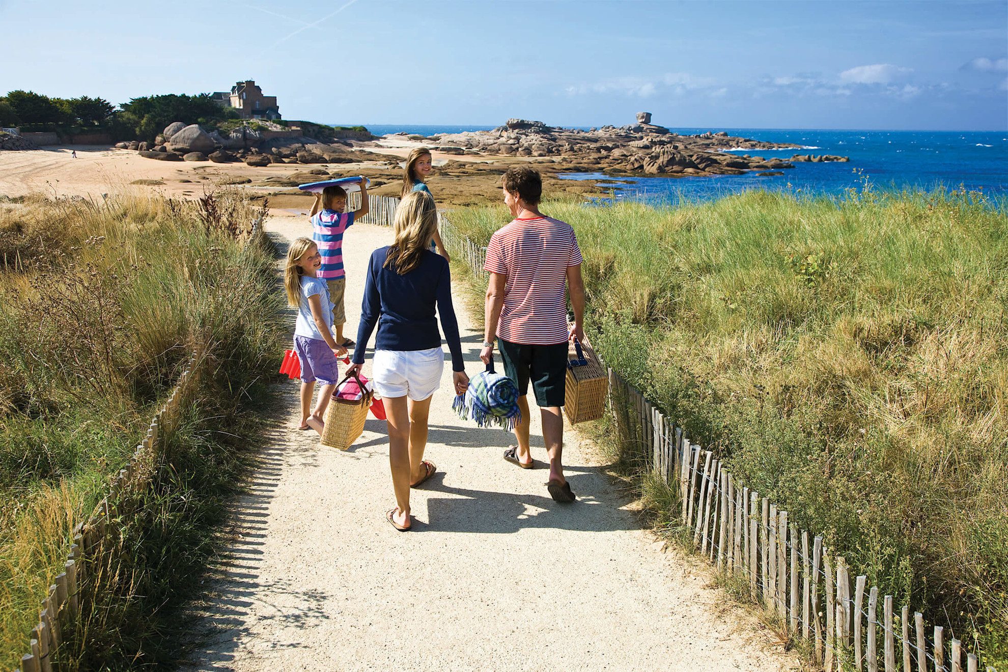 Family going to beach in Brittany