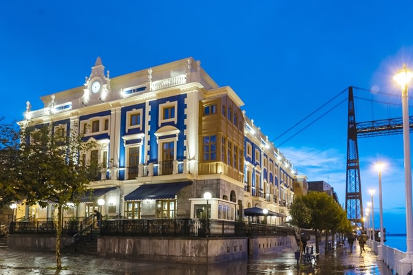 Exterior shot at night of Puente Colgante Boutique Hotel, Portugalete