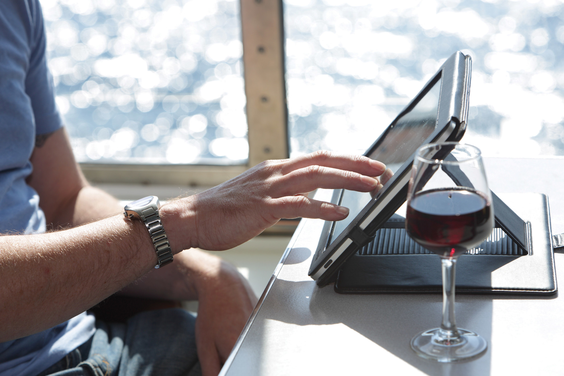 Person using a tablet onboard