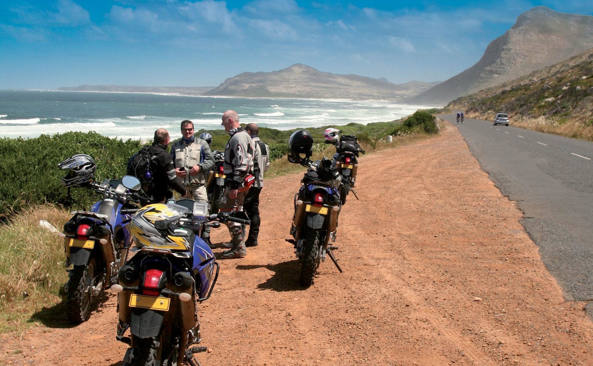Motorbikes stopping for a break by the sea
