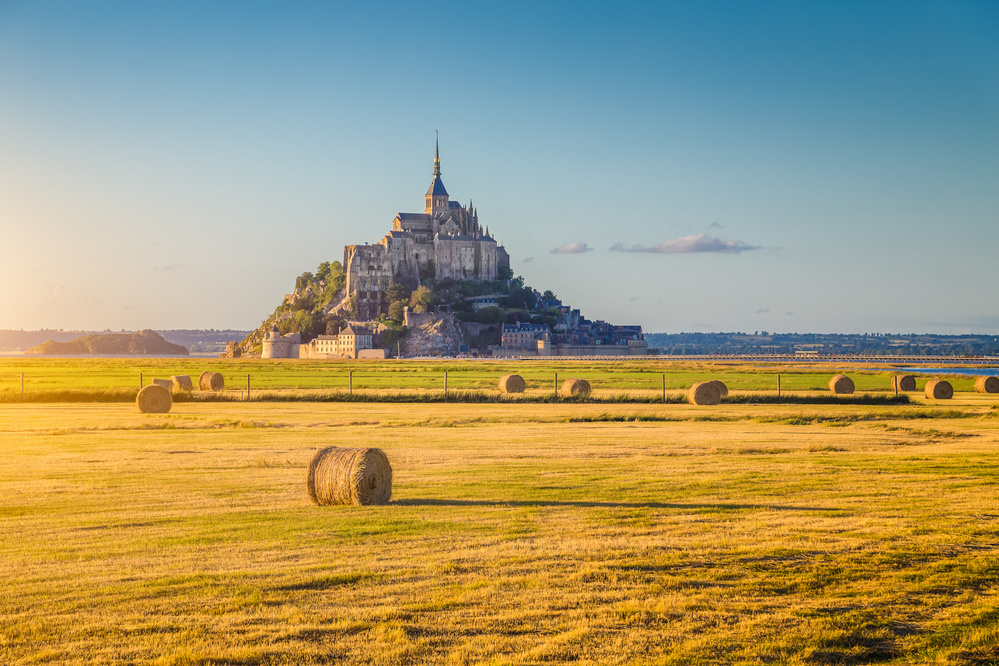 Mont St Michel and hay bales at harvest time © Shutterstock