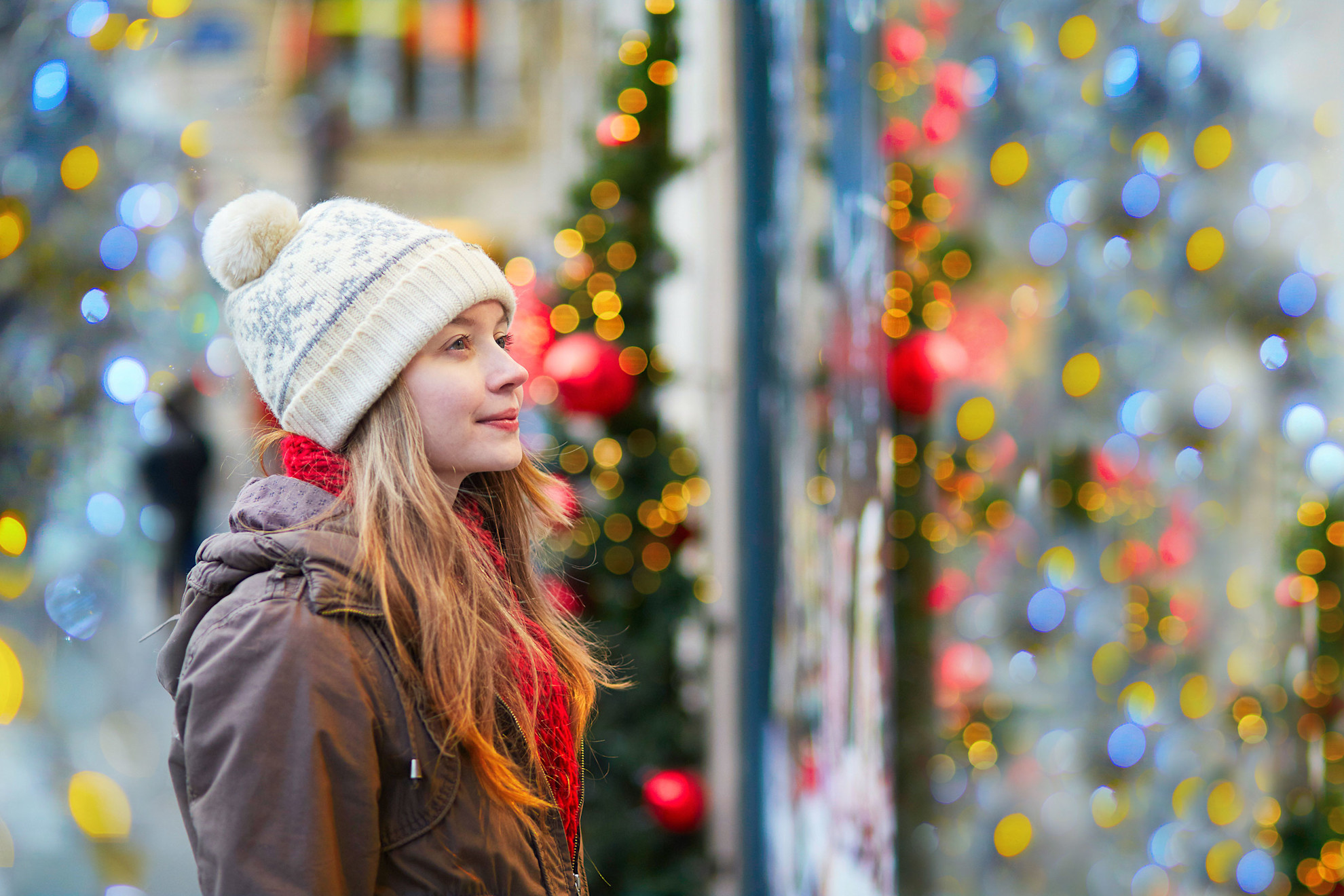 Woman looking in Christmas window